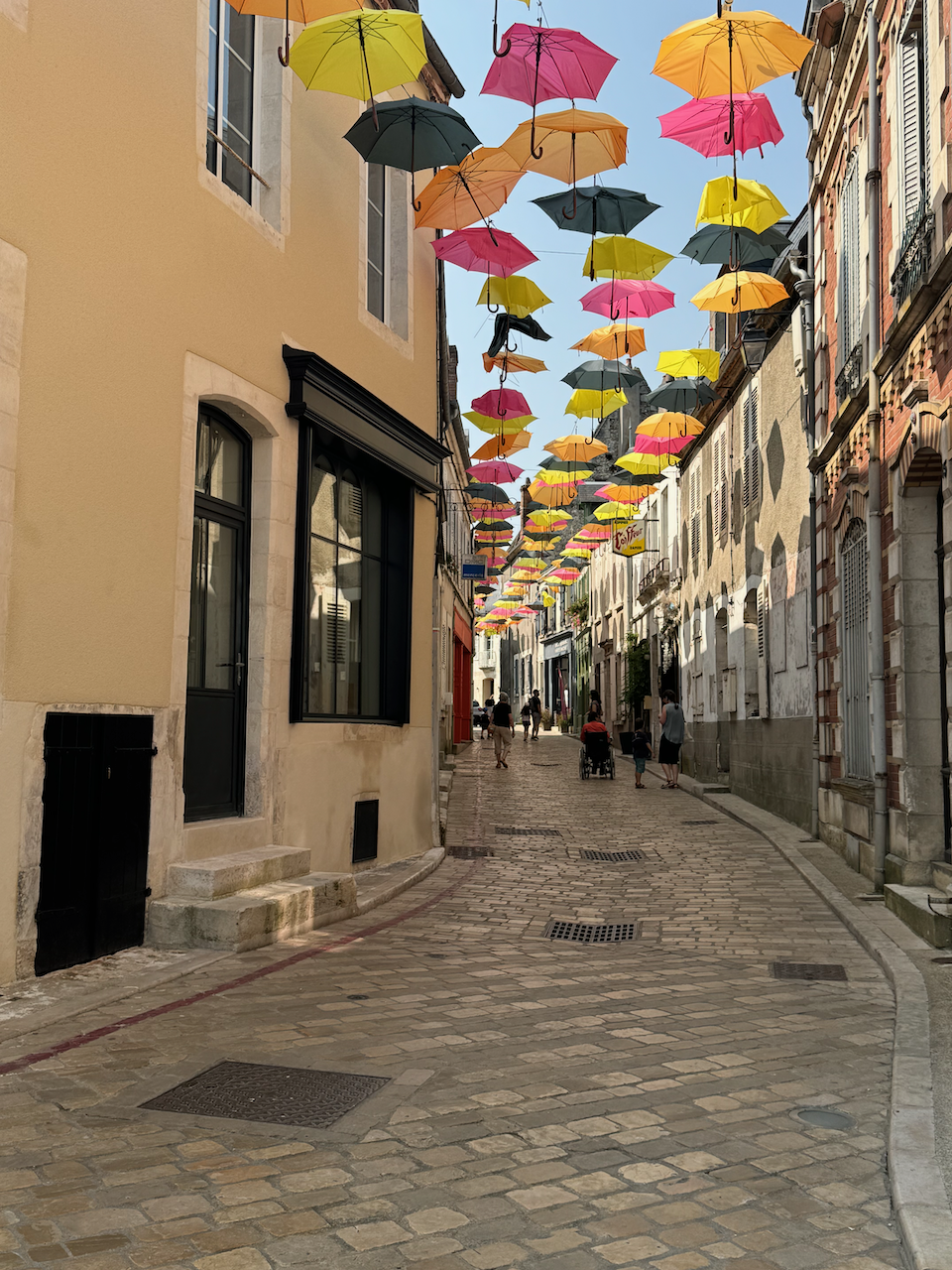 Colourful umbrellas above street in Sancerre